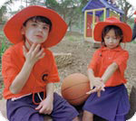 Kids applying sunscreen at school